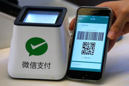 A WeChat Pay system is demonstrated at a canteen as part of Tencent office inside TIT Creativity Industry Zone in Guangzhou, China May 9, 2017. REUTERS/Bobby Yip/Files