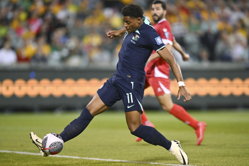 Kusini Yengi of Australia scores a goal during the Soccer World Cup qualifying match between Lebanon and Australia in Canberra, Australia, Tuesday, March 26, 2024. (AP Photo/Lukas Coch)