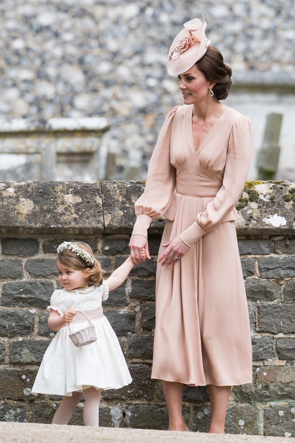 <p>The Duchess wears Alexander McQueen at Pippa Middleton's wedding (along with an adorable Princess Charlotte).</p>