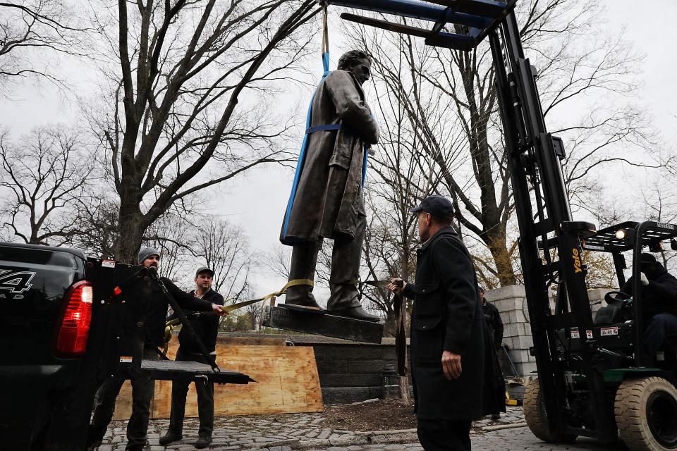 A statue of J. Marion Sims is loaded onto a Parks Department truck after being taken down from its pedestal at Central Park and East 103rd Street on April 17, 2018 in New York City.