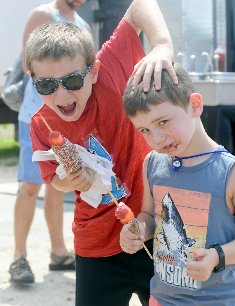 Last year, Avery, then 7, left, and 4-year-old Cody Brunetti chowed down on milk chocolate covered strawberries at the Cape Cod Food Truck & Craft Beer Festival.