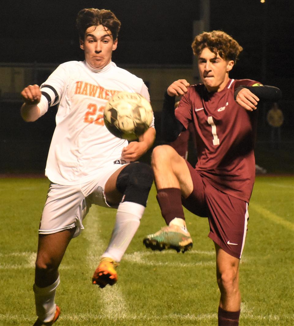 Cooperstown Hawkeye Conrad Erway (22) and Frankfort-Schuyler Maroon Knight Conner Grates (1) seek control of the ball on a throw-in Tuesday.