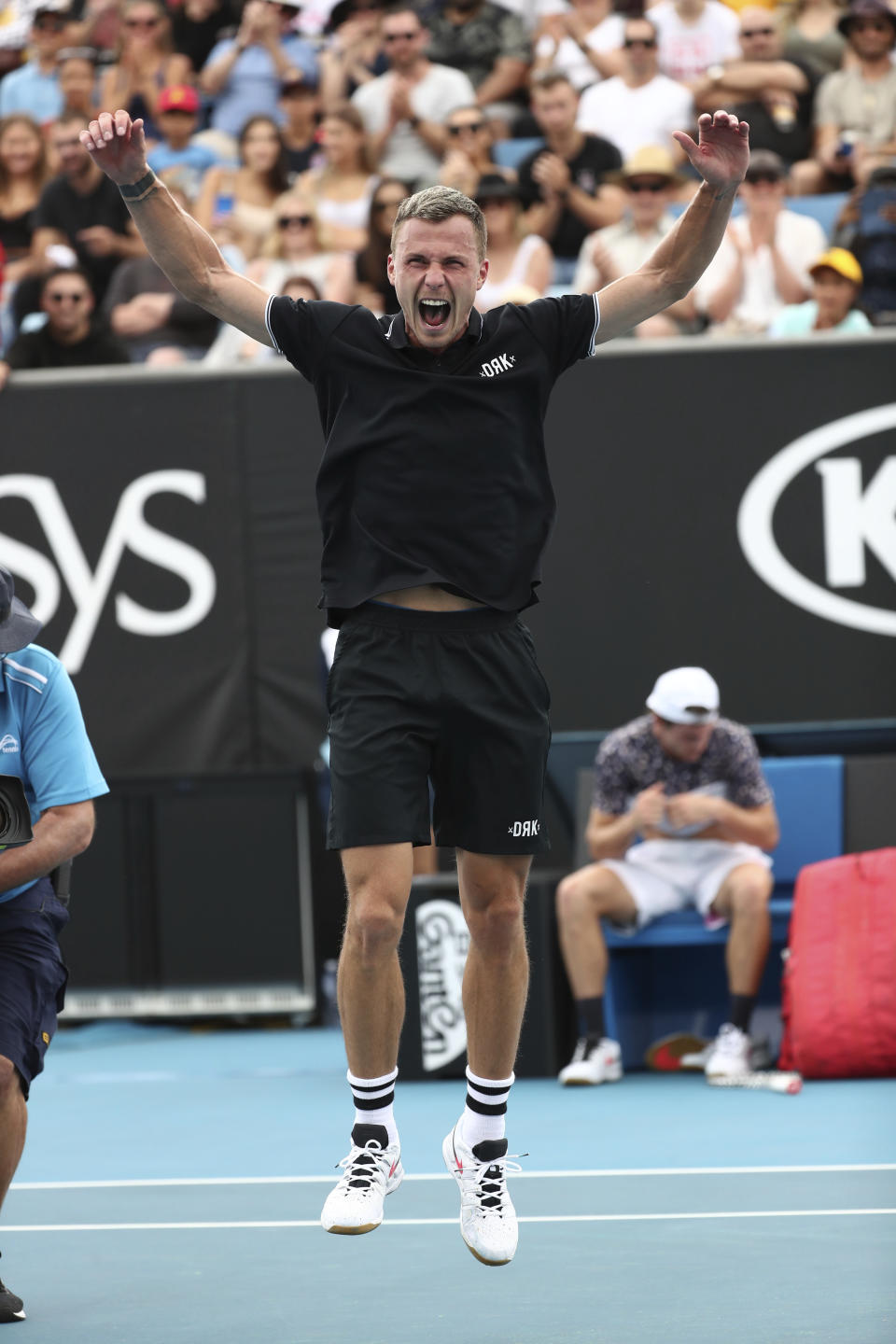 Hungary's Marton Fucsovics celebrates after defeating Tommy Paul of the U.S. in their third round match at the Australian Open tennis championship in Melbourne, Australia, Friday, Jan. 24, 2020. (AP Photo/Dita Alangkara)