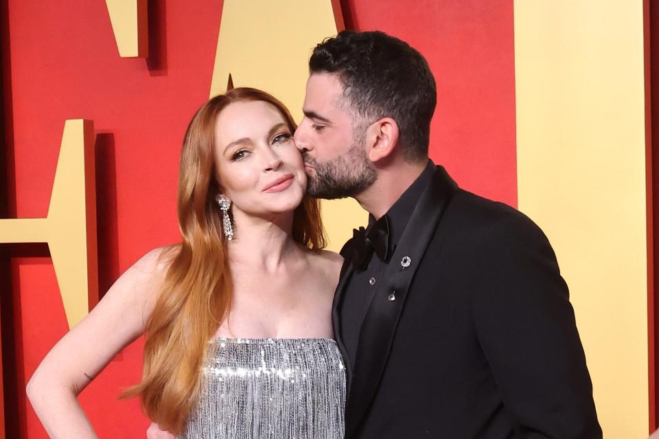 Lindsay Lohan's husband Bader Shammas kisses her on the cheek