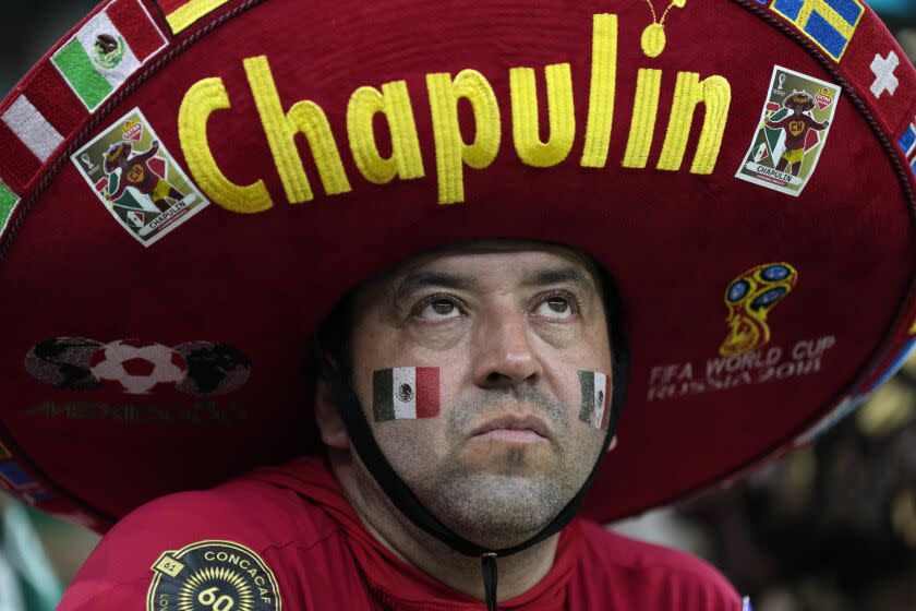 A Mexico fan on the stands reacts at the end of the World Cup group C soccer match between Saudi Arabia and Mexico, at the Lusail Stadium in Lusail, Qatar, Wednesday, Nov. 30, 2022. Mexico won 2-1 but failed to advance in the tournament. (AP Photo/Ricardo Mazalan)