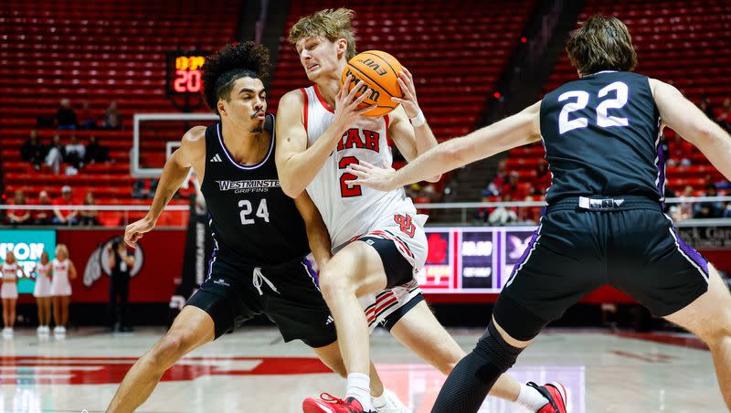 Utah guard Cole Bajema, center, drives through the Westminster defense during an exhibition game at the Huntsman Center in Salt Lake City on Wednesday, Nov. 1, 2023.