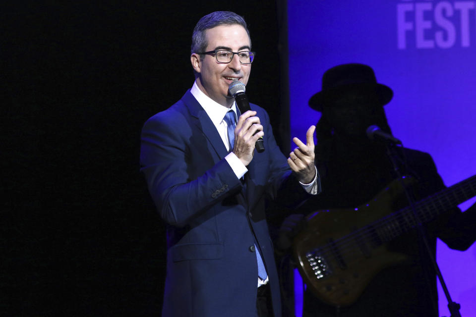 FILE - In this Nov. 4, 2019 file photo, John Oliver performs at the 13th annual Stand Up For Heroes benefit concert in support of the Bob Woodruff Foundation at the Hulu Theater at Madison Square Garden in New York. Danbury, Conn., Mayor Mark Boughton announced a tongue-in-cheek move posted on his Facebook page on Saturday, Aug. 22, 2020, to rename Danbury's local sewage treatment plant after Oliver following the comedian's expletive-filled rant about the city. (Photo by Greg Allen/Invision/AP, File)