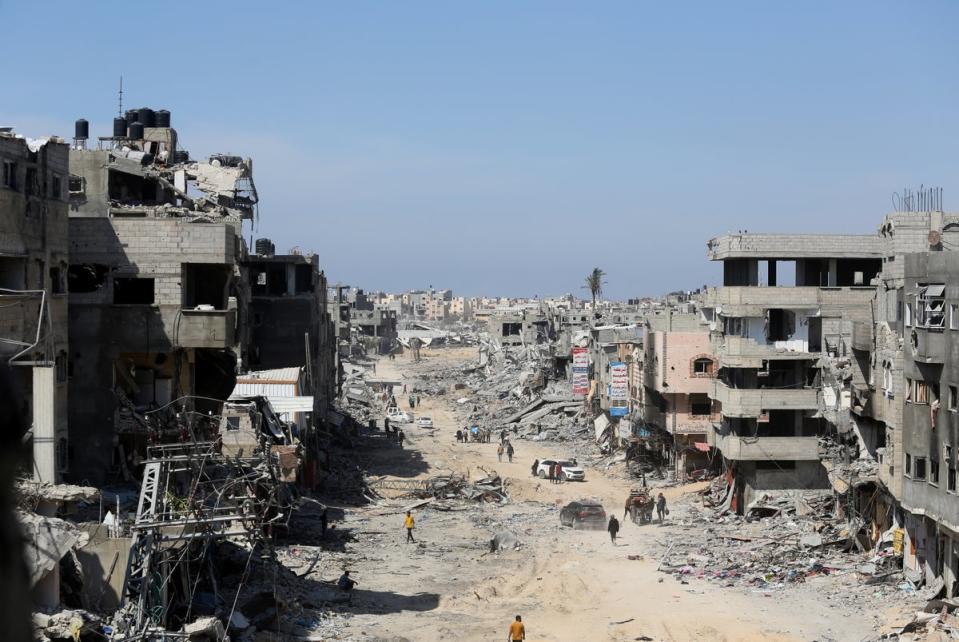 Buildings reduced to rubble in Khan Younis, Gaza, after the Israeli military withdrew most of its ground troops from the region (Reuters)