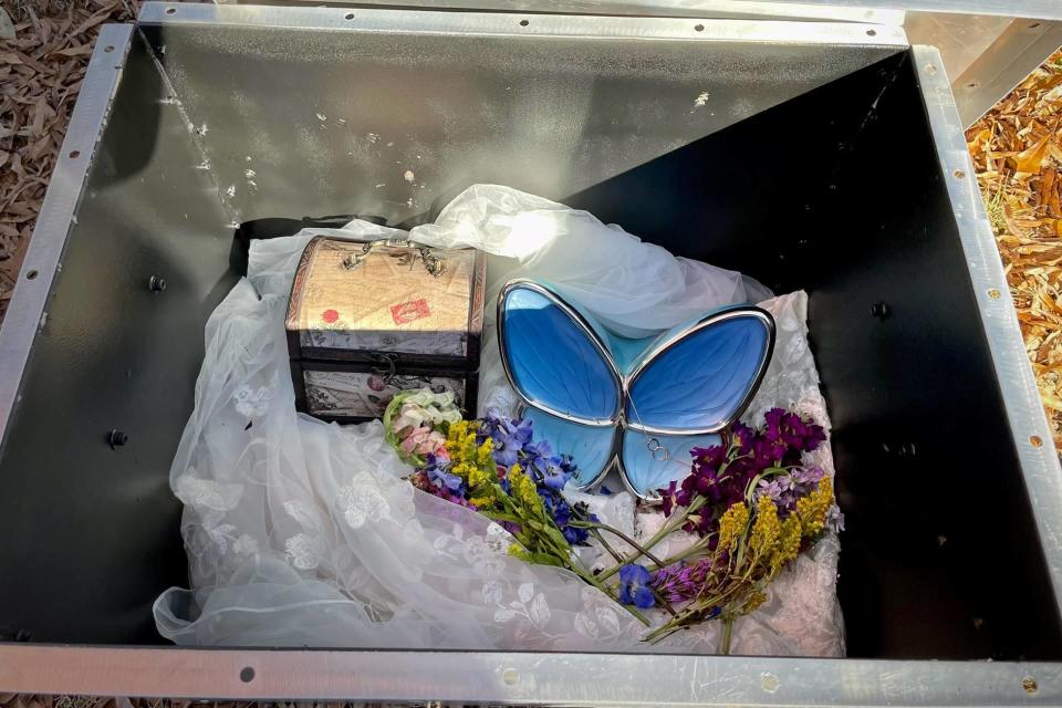 Half of Christy Giles' ashes would go to  to her husband to scatter in the places they loved. Her mother placed the rest in an urn inside a butterfly box and gently wrapped it in the wedding dress she never had the chance to wear. / Credit: Dusty Giles