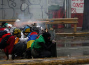 Demonstrators clash with riot security forces while rallying against Venezuela's President Nicolas Maduro's government in Caracas, Venezuela, July 28, 2017. REUTERS/Carlos Garcia Rawlins