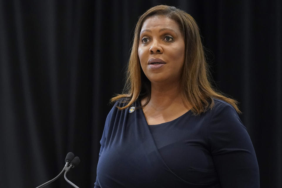 New York Attorney General Letitia James stands at a podium.