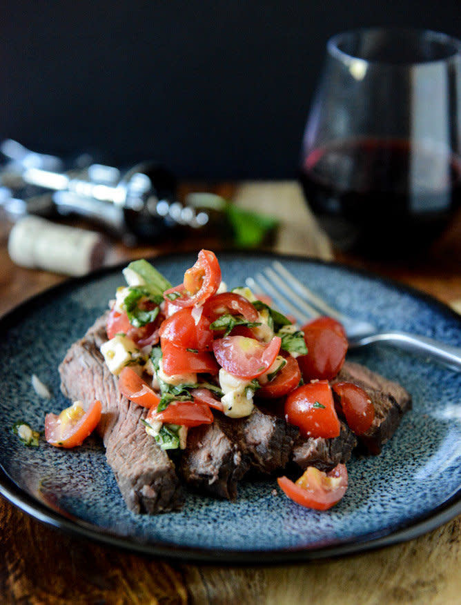 <strong>Get the <a href="http://www.howsweeteats.com/2013/04/red-wine-marinated-flank-steak-with-cherry-tomato-caprese-salsa/" target="_blank">Red Wine Marinated Flank Steak with Cherry Tomato Caprese Salsa recipe</a> from How Sweet It Is</strong>