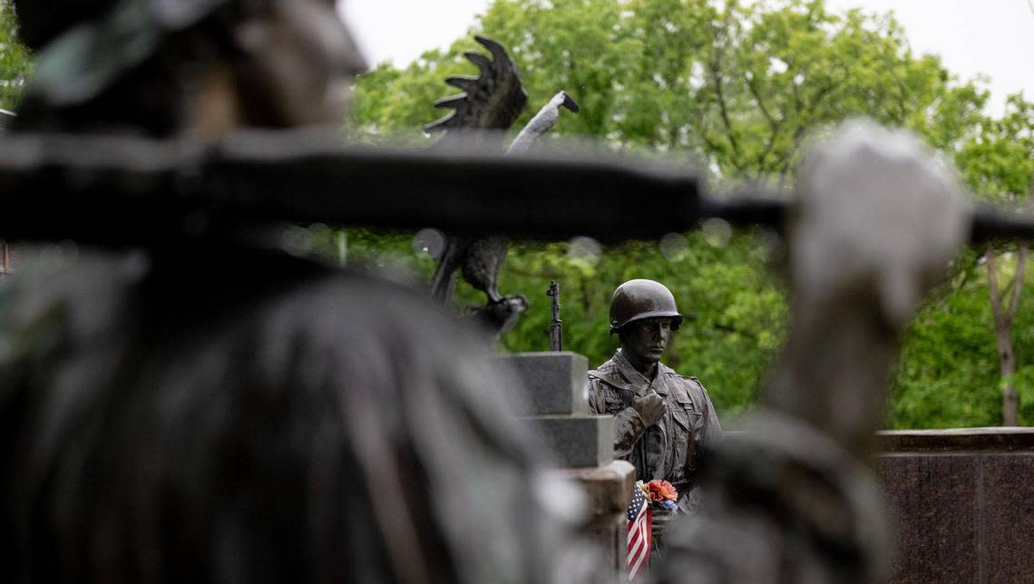 Statues representing soldiers from two U.S. conflicts are part of this memorial.