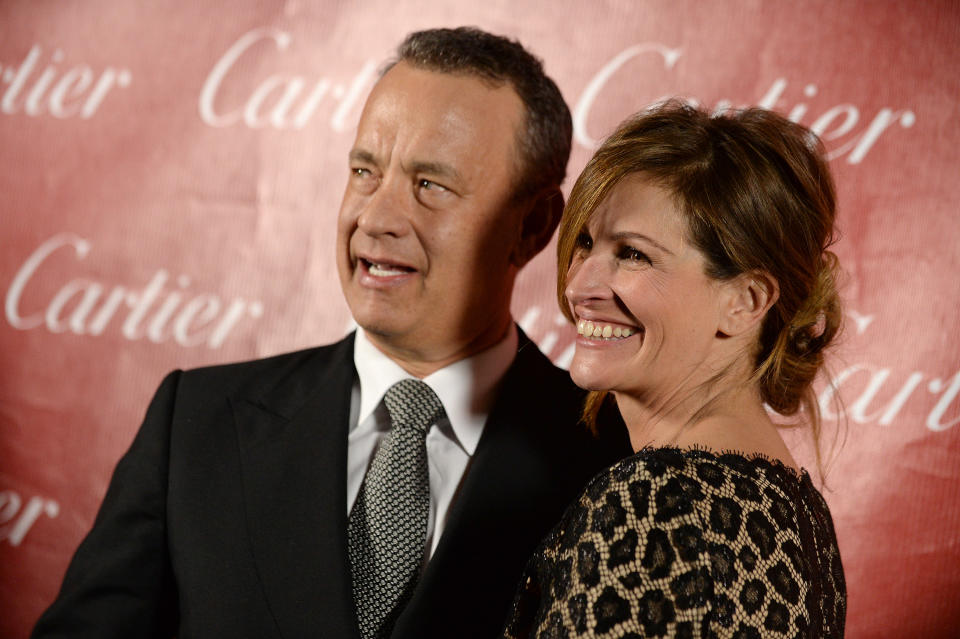 Tom Hanks, left, and Julia Roberts pose backstage at the Palm Springs International Film Festival Awards Gala at the Palm Springs Convention Center on Saturday, Jan. 4, 2014, in Palm Springs, Calif. (Photo by Jordan Strauss/Invision/AP)