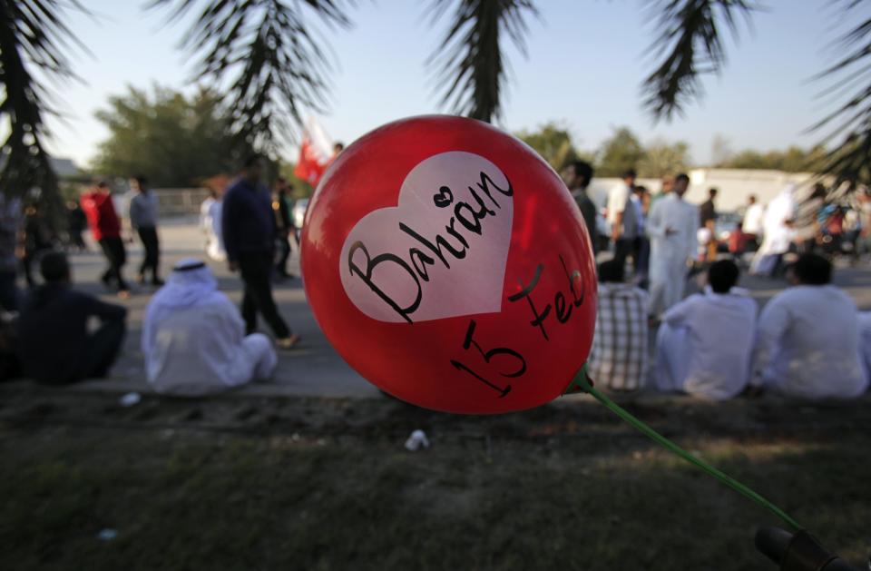 Bahrainis gather to join a pro-democracy march near Diraz, west of the capital Manama, Bahrain, Saturday, Feb. 15, 2014. Tens of thousands of protesters marched down a divided four-lane highway, calling for the long-serving prime minister, Sheik Khalifa bin Salman Al Khalifa, to step down and for democracy in the Gulf island kingdom. (AP Photo/Hasan Jamali)