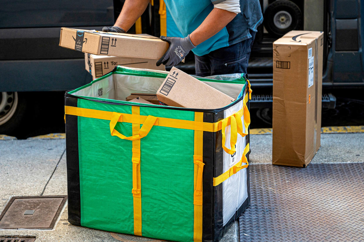 A worker delivers Amazon packages. (David Paul Morris / Bloomberg via Getty Images file)