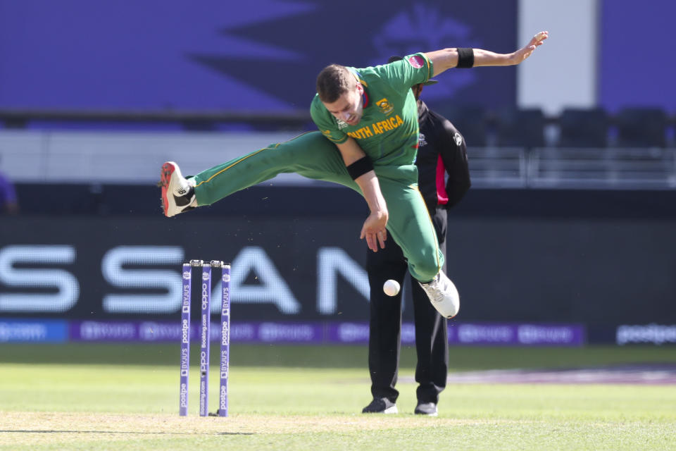 South Africa's Anrich Nortje is airborne as he fields the ball during the Cricket Twenty20 World Cup match between South Africa and the West Indies in Dubai, UAE, Tuesday, Oct. 26, 2021. (AP Photo/Kamran Jebreili )