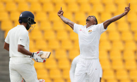 Cricket - Sri Lanka v India - Third Test Match - Pallekele, Sri Lanka - August 13, 2017 - Sri Lanka's Vishwa Fernando celebrates after taking the wicket of India's Wriddhiman Saha. REUTERS/Dinuka Liyanawatte