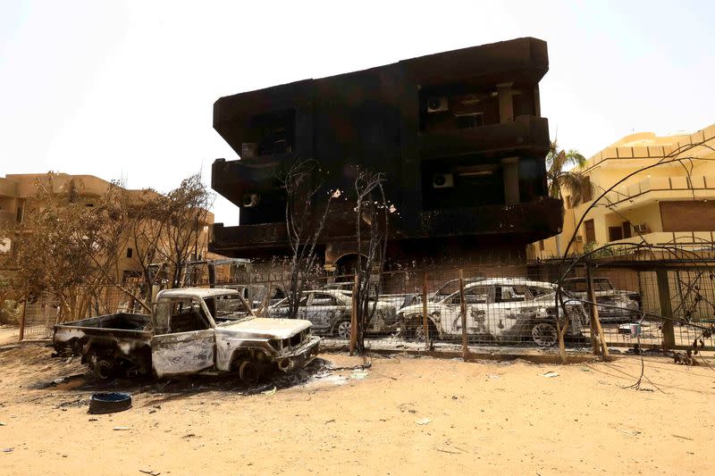 FILE PHOTO: Damaged cars and buildings are seen at the central market in Khartoum North