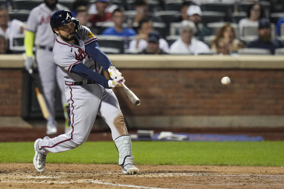 Atlanta Braves' Travis d'Arnaud hits a single during the seventh inning of a baseball game against the New York Mets Friday, Aug. 11, 2023, in New York. (AP Photo/Frank Franklin II)