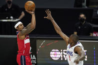 Washington Wizards guard Bradley Beal, left, shoots as Los Angeles Clippers center Serge Ibaka defends during the first half of an NBA basketball game Tuesday, Feb. 23, 2021, in Los Angeles. (AP Photo/Mark J. Terrill)