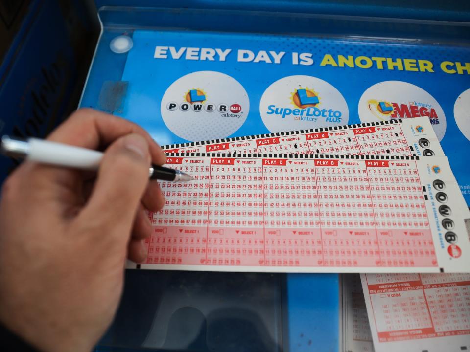 A person plays Powerball lottery at a 7-Eleven store in Milpitas, California, United States on November 7, 2022.