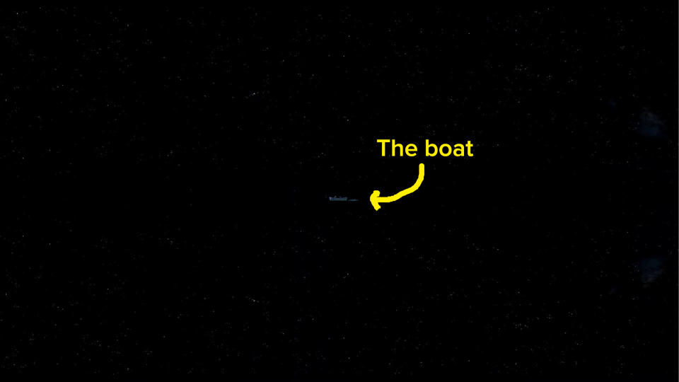 text and an arrow pointing out a boat in the darkness
