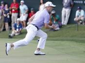 Sep 24, 2017; Atlanta, GA, USA; Justin Thomas reacts to his putt on the 18th green during the final round of the Tour Championship golf tournament at East Lake Golf Club. Mandatory Credit: Brett Davis-USA TODAY Sports