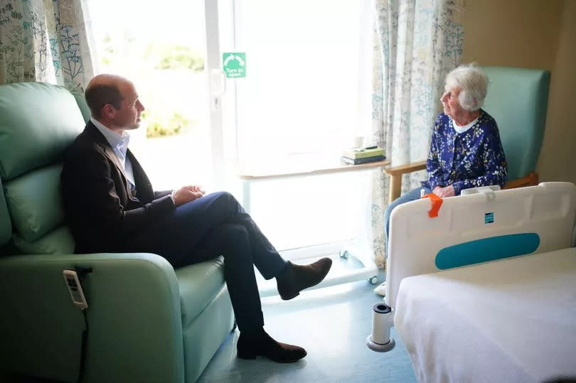 With a patient at St Mary's Community Hospital -Credit:Getty Images