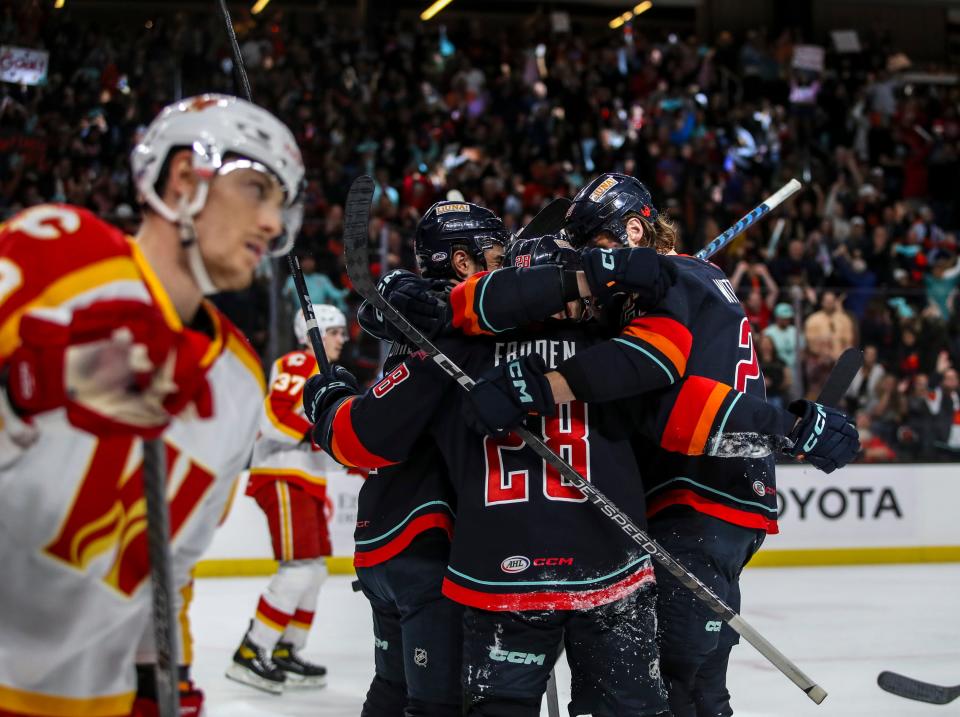 Coachella Valley Firebirds forward Jesper Froden (28) celebrates with teammates after scoring the first goal of the night during the first period of game five of the Pacific Division finals at Acrisure Arena in Palm Desert, Calif., Friday, May 19, 2023.