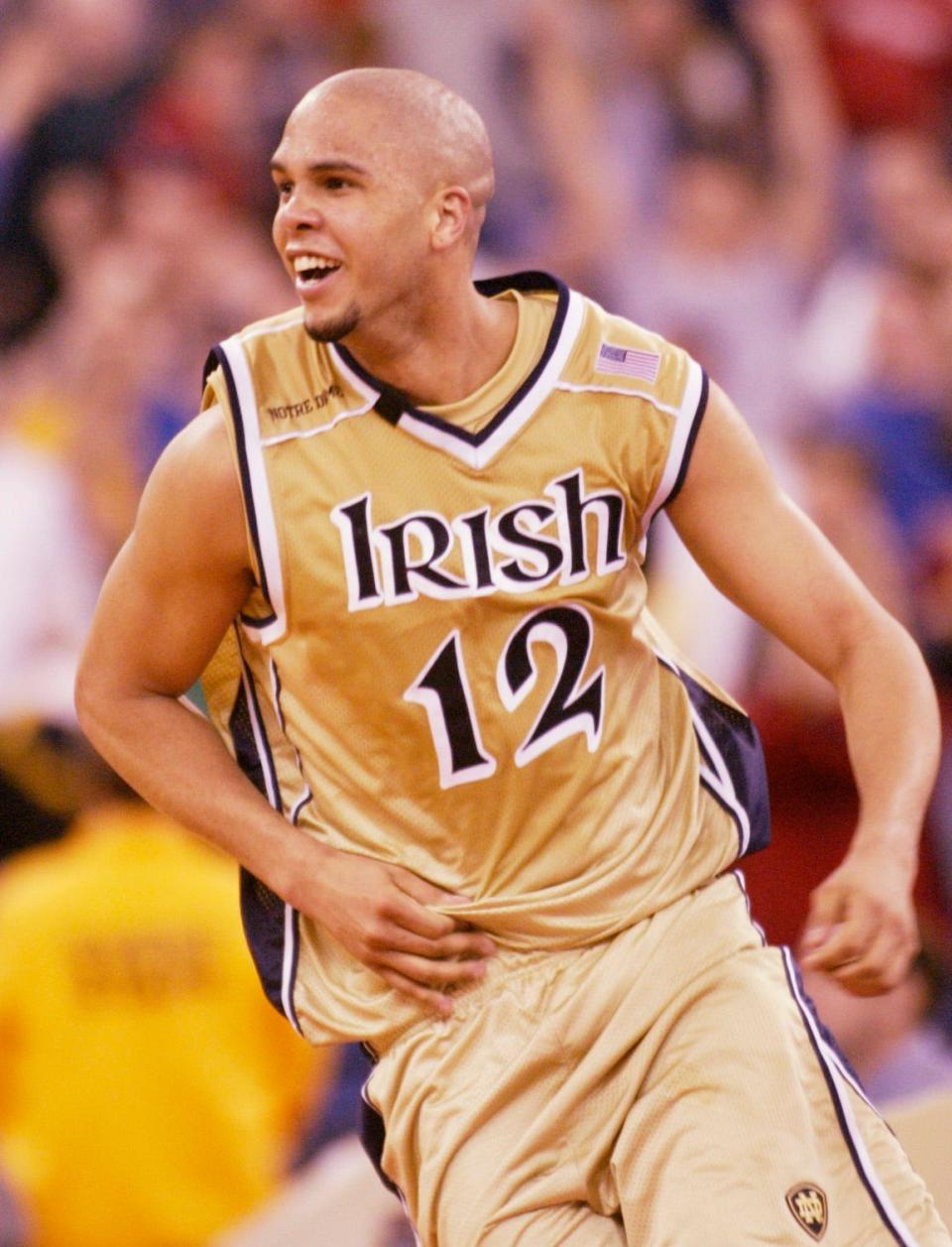 Jordan Cornette, of Notre Dame, shown in this 2003 file photo, runs around the court after his team's beating of Milwaukee in the first round of the NCAA tournament.