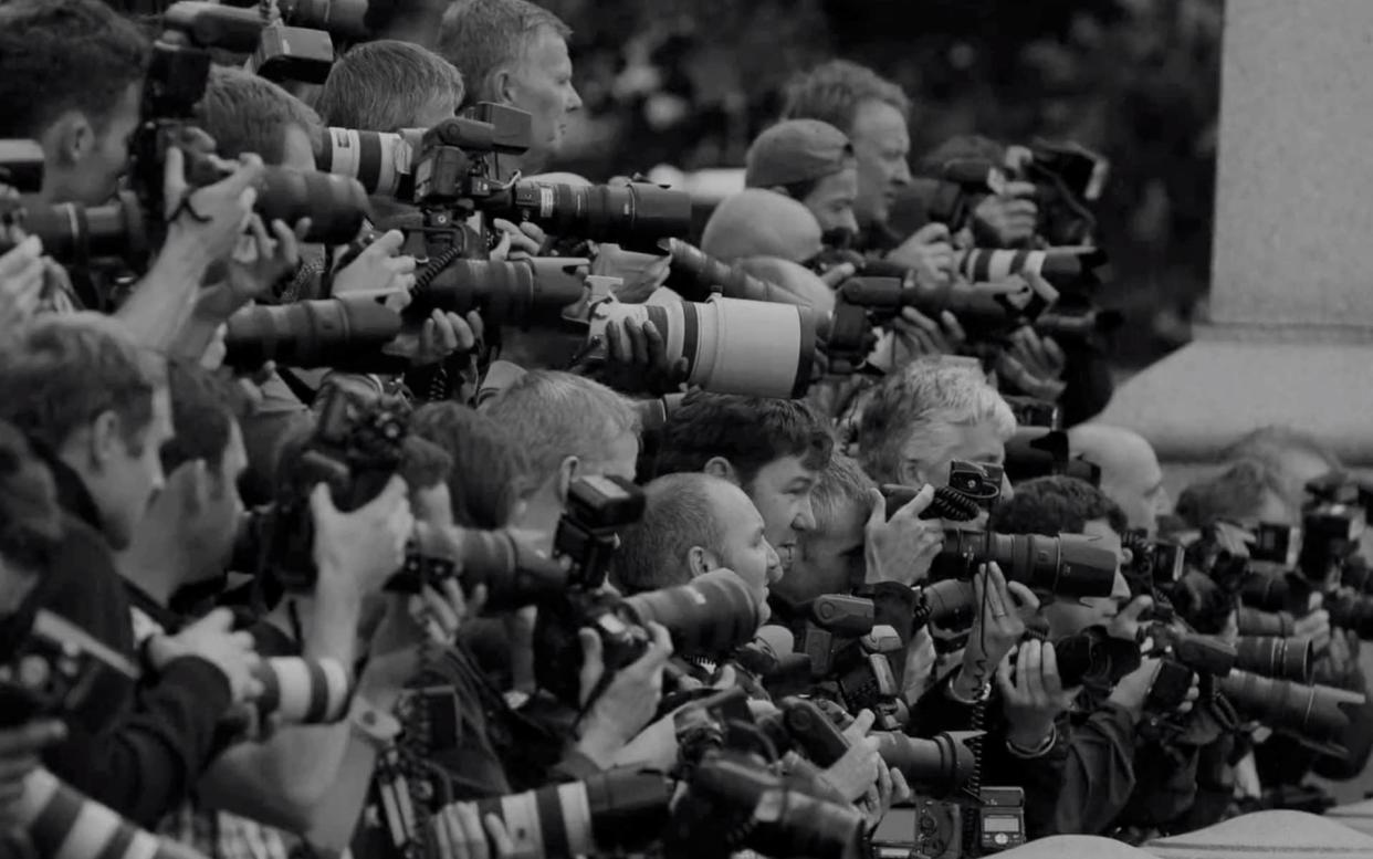 This image from the trailer shows official photographers at the London premiere of Harry Potter and the Deathly Hallows: Part Two, in July 2011 - not paparazzi hounding the Sussexes - Netflix