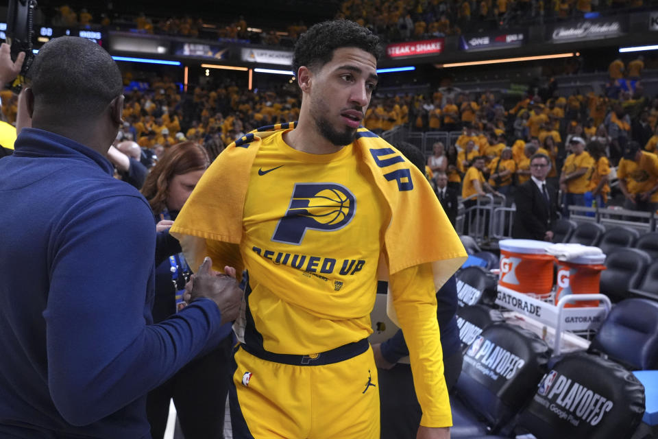 Indiana Pacers guard Tyrese Haliburton walks off the court after Game 6 against the New York Knicks in an NBA basketball second-round playoff series, Friday, May 17, 2024, in Indianapolis. The Pacers won 116-103. (AP Photo/Michael Conroy)