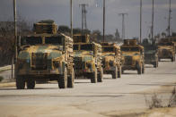 Turkish military convoy drives in Idlib province, Syria, Saturday, Feb. 22, 2020. A Turkish soldier was killed in Syria's northwest Idlib province, state-run Anadolu news agency reported Saturday. (AP Photo/Ghaith Alsayed)