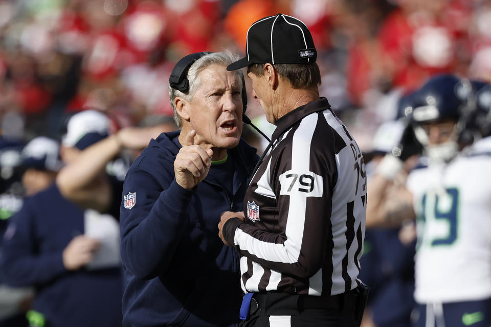 Seattle Seahawks head coach Pete Carroll, left, gestures while talking to down judge Kent Payne (79) during the first half of an NFL football game between the San Francisco 49ers and the Seahawks in Santa Clara, Calif., Sunday, Dec. 10, 2023. (AP Photo/Josie Lepe)