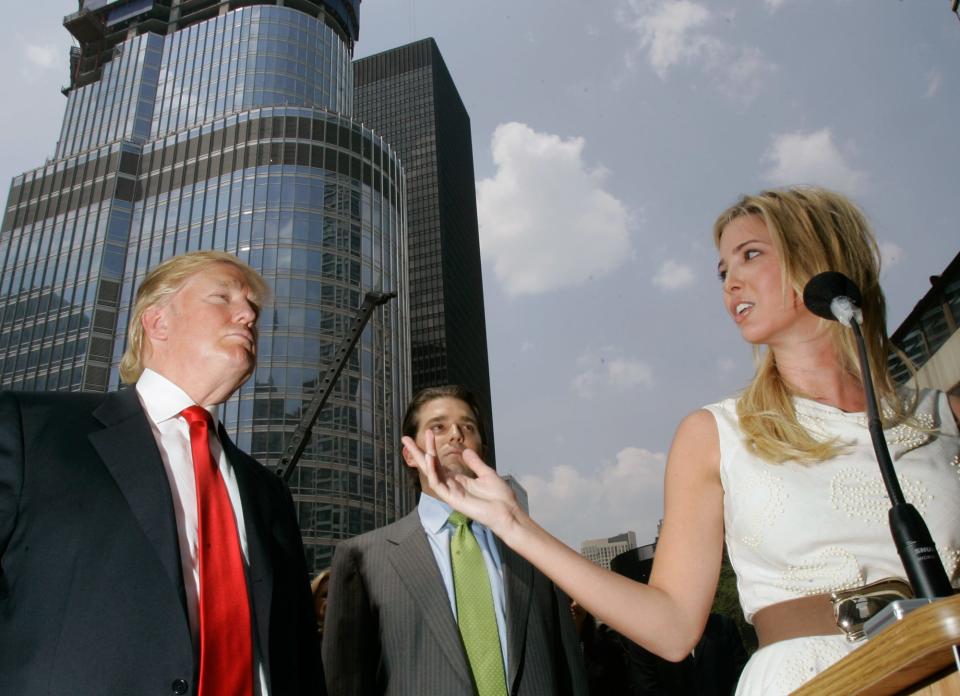 Donald Trump, left, listens to his daughter Ivanka, right, talk about his 92-story Trump International Hotel & Tower during a news conference on construction progress in Chicago, Thursday, May 24, 2007