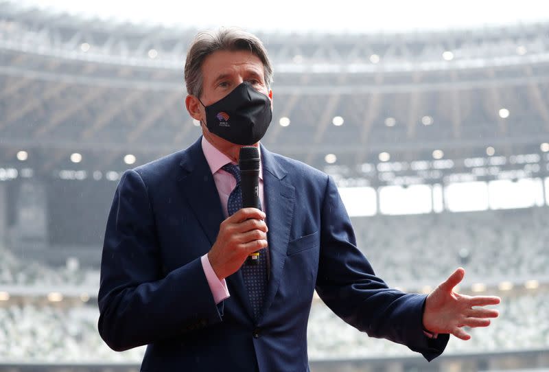 World Athletics President Sebastian Coe wearing a protective face mask speaks to media as he inspects at the National Stadium, amid the coronavirus disease (COVID-19) outbreak in Tokyo