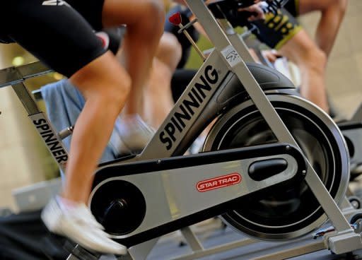 Participants ride exercise bikes during a group outdoor fitness promotion in Sydney. Researchers have found that brisk walking for up to 75 minutes per week was associated with a gain of 1.8 years in life expectancy