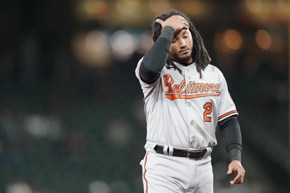 Baltimore Orioles' Freddy Galvis reacts as he walks to the dugout after Chance Sisco grounded out with the bases loaded to end the top of the sixth inning of a baseball game against the Seattle Mariners, Tuesday, May 4, 2021, in Seattle. (AP Photo/Ted S. Warren)