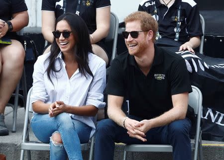 Britain's Prince Harry and his girlfriend actress Meghan Markle watch the wheelchair tennis event during the Invictus Games in Toronto, Ontario, Canada September 25, 2017. REUTERS/Mark Blinch