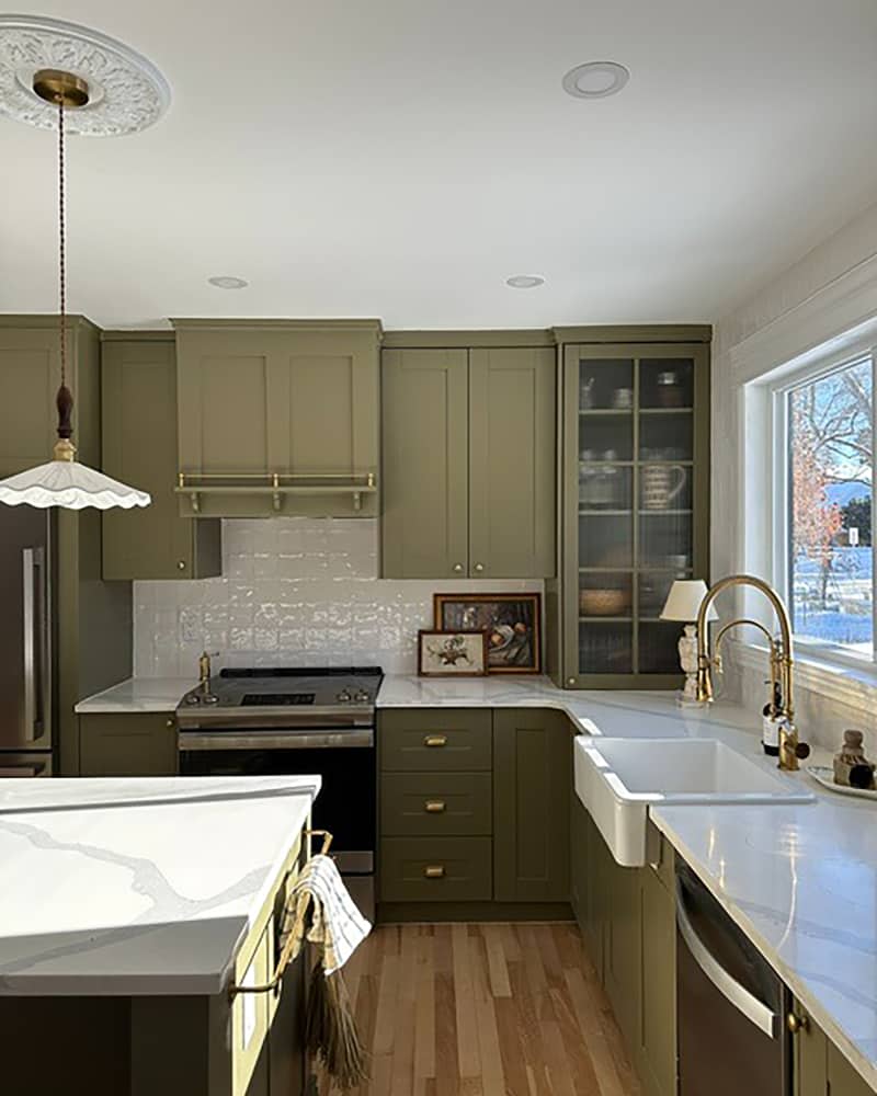 Olive green cabinets in newly renovated kitchen.