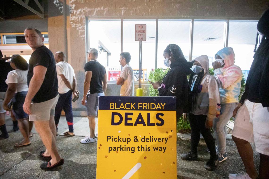 A line of about 20 people are set to go inside to shop at the Walmart on 1425 NE 163rd St. in North Miami Beach, Florida, on Black Friday, Nov. 25, 2022, at about 5 a.m.