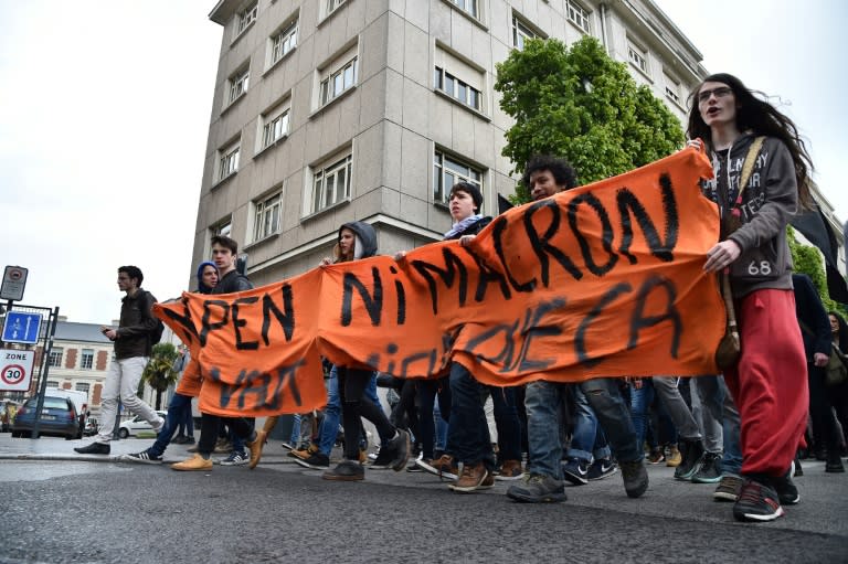 Protesters hold a banner reading "Neither Le Pen nor Macron" at a demonstration in the French city of Rennes