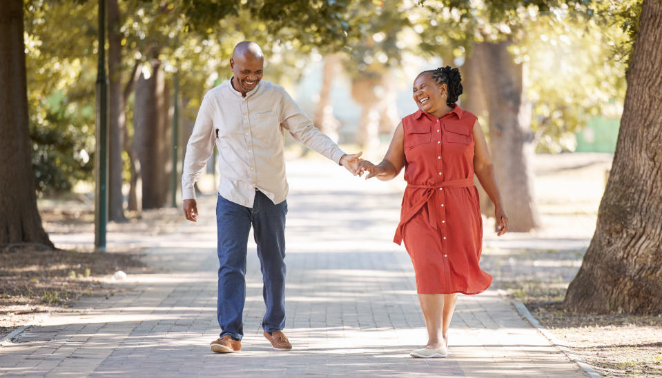 couple holding hands on a walk