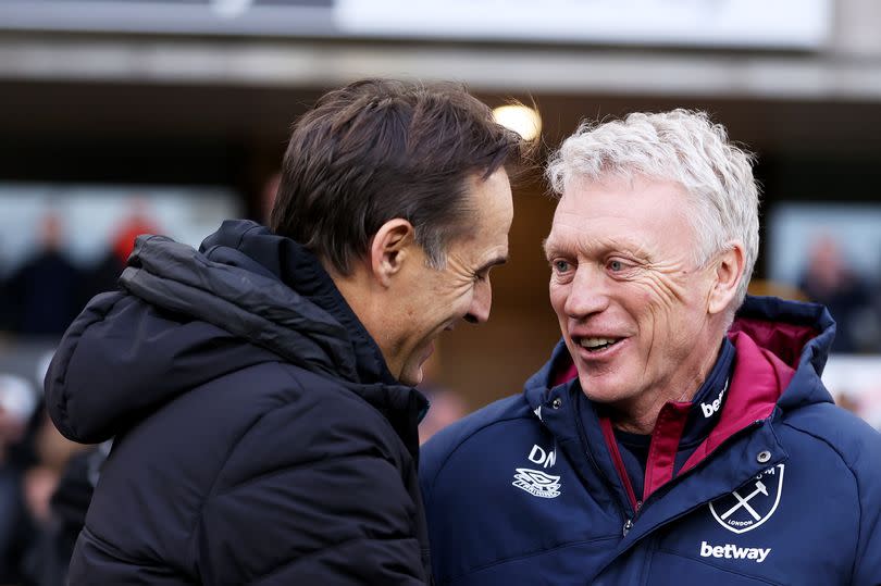 Julen Lopetegui, former manager of Wolverhampton Wanderers (L) embraces David Moyes, manager of West Ham United