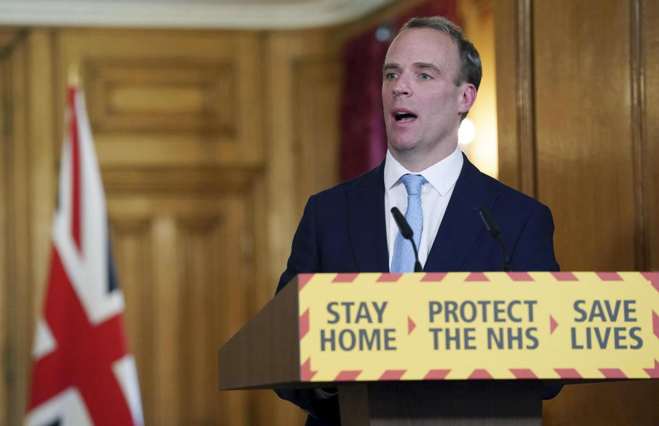 In this photo provided by 10 Downing Street, Britain's Foreign Secretary Dominic Raab delivers a speech,  during a coronavirus briefing in Downing Street, London, Monday April 6, 2020. (Pippa Fowles/10 Downing Street via AP)