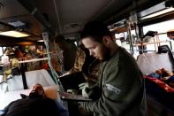 Ukrainian volunteer medics use a converted bus to transport wounded Ukrainian soldiers from the eastern frontline near Bakhmut to a hospital in Dnipro