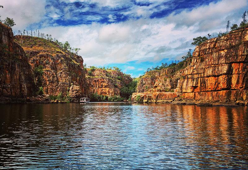 <p>Hop on a boat and cruise through the 100m deep Katherine Gorge - a series of gorges formed by the Katherine River cutting through sandstone of the southern Arnhem Land plateau. You’ll take in magnificent, towering sandstone cliffs, stunning waterfalls and sandy beaches, used by the local freshwater crocodiles as nesting grounds. Most tours will also take you to some of the 450 ancient Aboriginal rock art sites in the gorge, some of which is estimated to be up to 8000 years old.</p>
