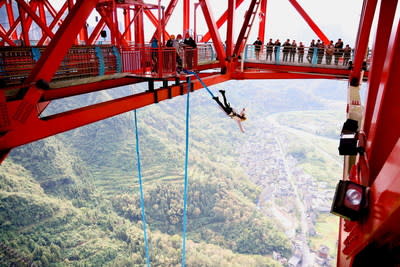 Tourists went bungee jumping on the Aizhai Grand Bridge of the Xiangxi UNESCO Global Geopark