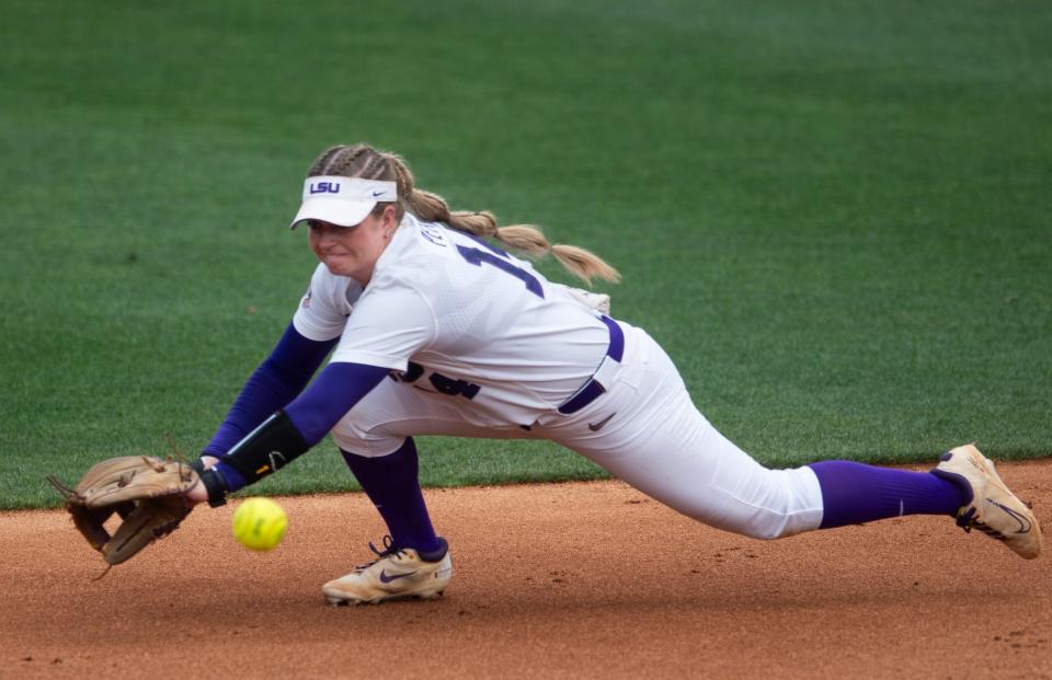 LSU Tigers infielder Karli Petty (14) comes up short on a line drive during the SEC softball tournament at Jane B. Moore Field in Auburn, Ala., on Wednesday, May 8, 2024. LSU Tigers defeated Alabama Crimson Tide 3-2 in 14 innings.